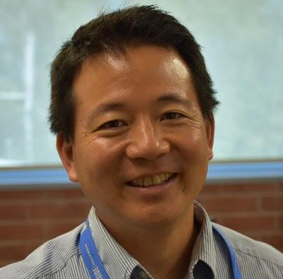 Photo of a man smiling in the camera